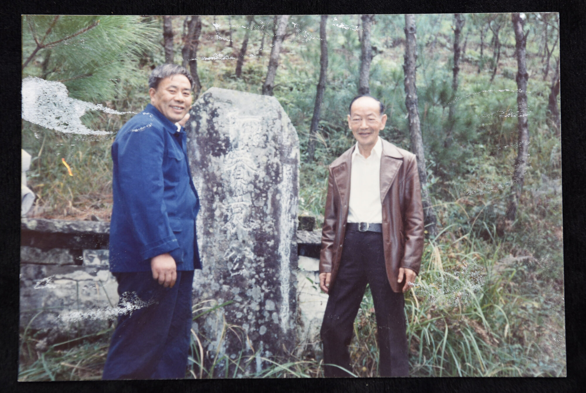 Wai Ching YUEN with a relative in front of their ancestral grave