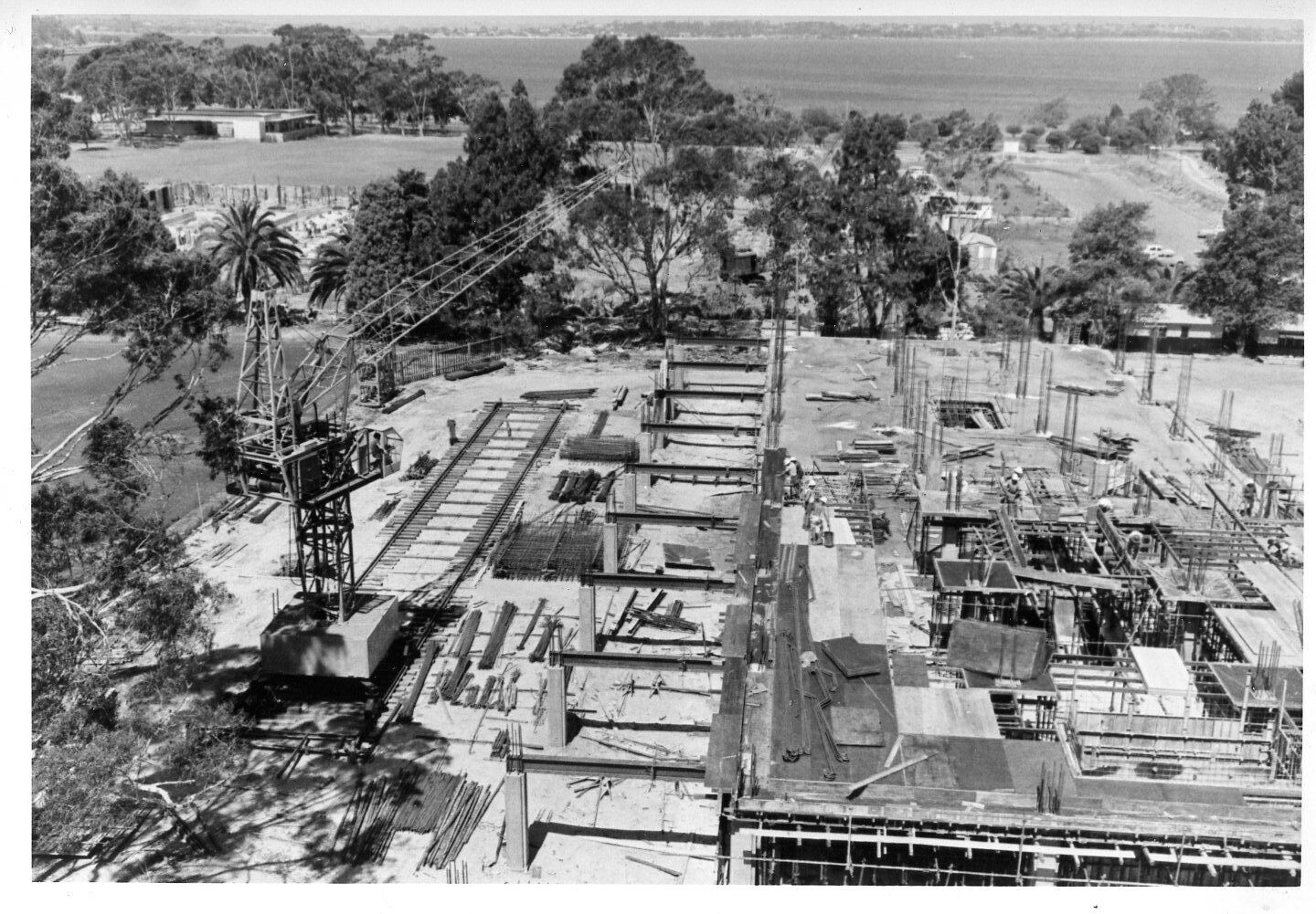 539P - Aerial view of Library Building and Arts Building under construction from Physics Building - Crane on tracks - Workers - 14 December 1962