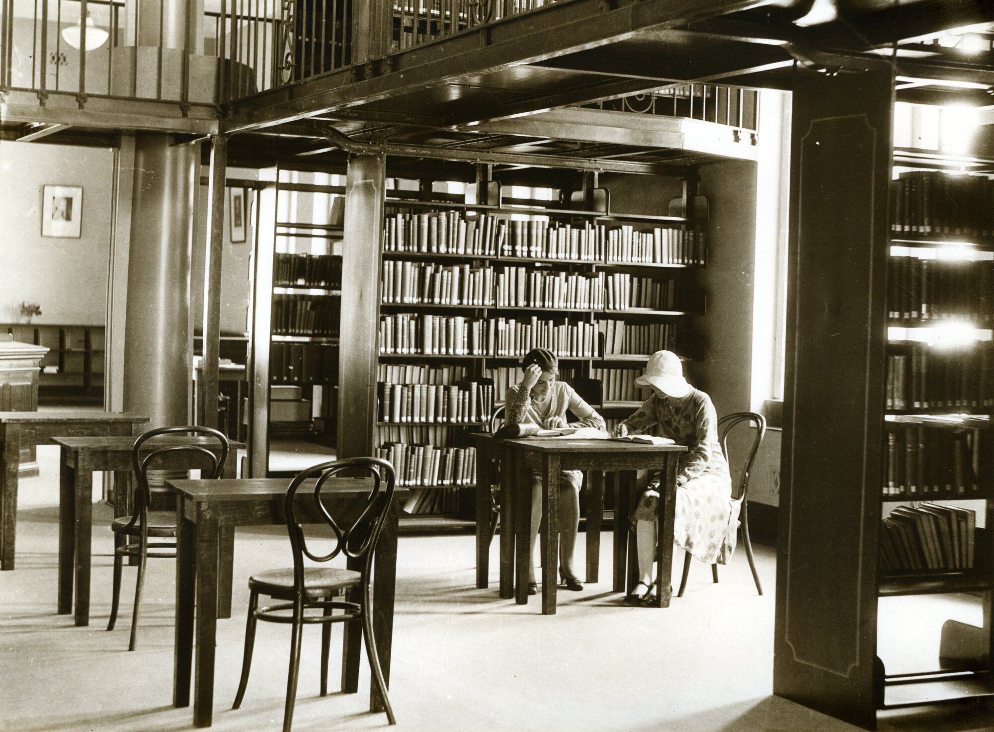 1956P - Library interior -  Administration building - 2 female students studying - circa 1939