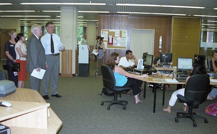 60389P - The launch of the newly completed refurbishments to the Reid Library - Librarian John Arfield shows guests including Vice Chancellor Alan Robson the refurbishments - interior - students using reference computers