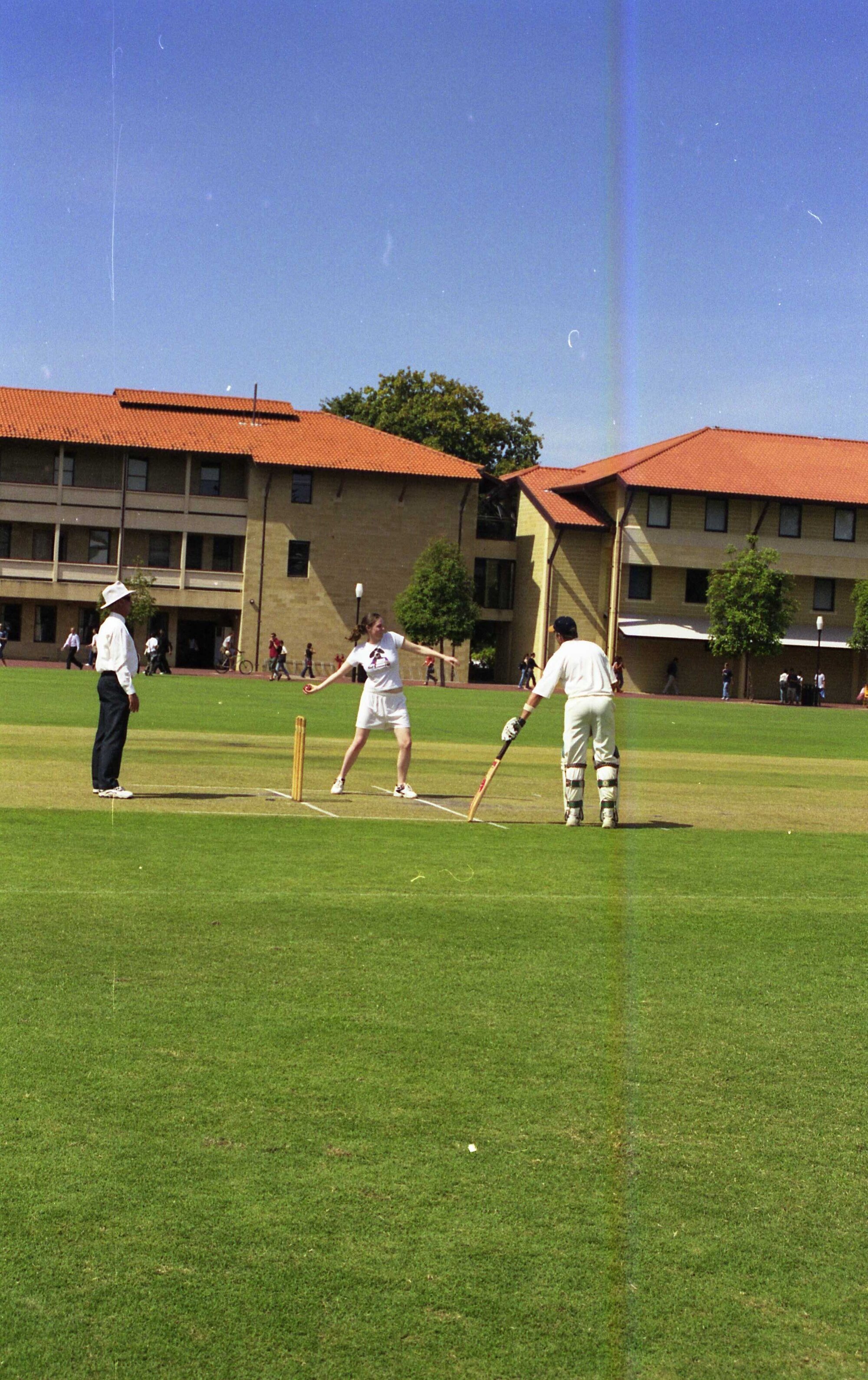 59104P - Festival of Cricket - Guild President Susie Byers bowling at the staff versus students social match - The Vice Chancellor's team was victorious at UWA's annual Festival of Cricket