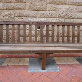 62767P - UWA Benches Project - NEDLANDS : PRESENTED BY THE CITIES OF NEDLANDS & SUBIACO TO COMMEMORATE THE 75th ANNIVERSARY OF THE UNIVERSITY MARCH 1988 - Gillett Promenade, Geography Gable - Close Up