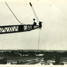 69P - Construction - Winthrop Hall - View from the crane looking south west towards river - Workers sitting on crane gantry - circa 1931