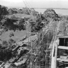 554P - Aerial view of Library Building and Arts Building under construction from Physics Building - Workers on top level of library - 10 June 1963