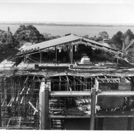 558P - Aerial view of Library Building under construction from Physics Building - Workers on roof level of library - 22 July 1963