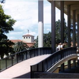 3120P - Students on bridge to Reid Library verandah - Arts building weathervane in background