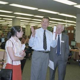 60390P - The launch of the newly completed refurbishments to the Reid Library - Librarian John Arfield shows guests including Vice Chancellor Alan Robson & Guild President Natalie Hepburn the refurbishments - interior - students using reference computers 