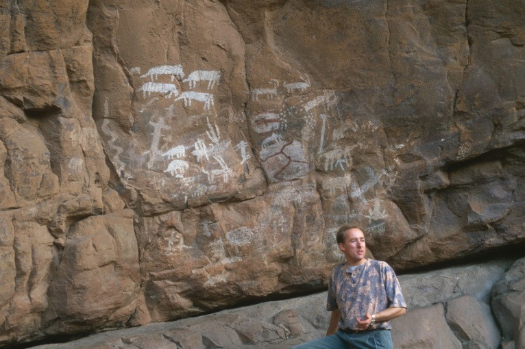 Benjamin Smith in the a rock shelter with Northern Sotho rock art (photograph by Sven Ouzman 1997)