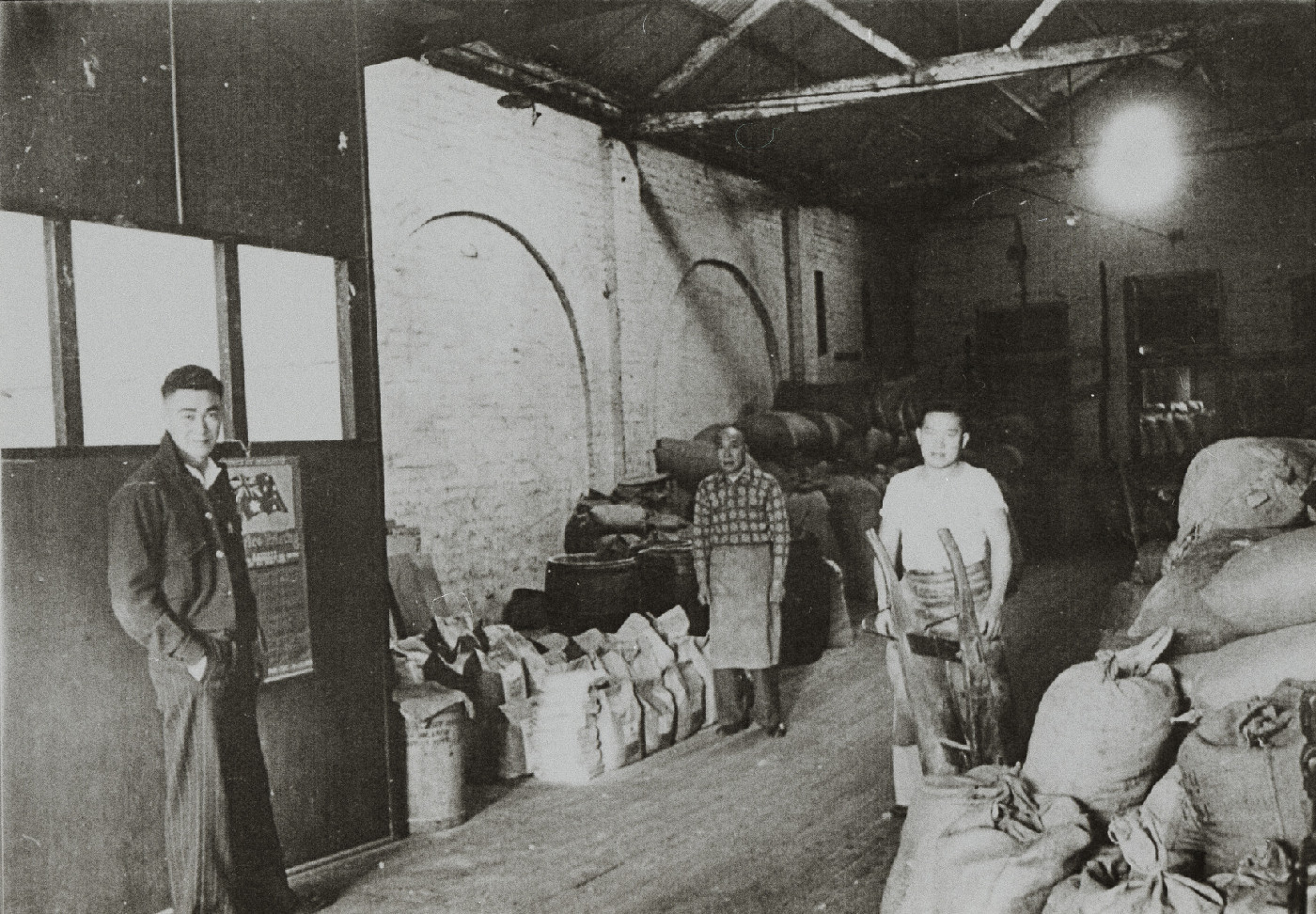 Ping Chang, Phillip Quon, Len Chiew inside J & S Chiew & Co Produce Merchants, 99-101 James Street, Perth, 1953.
SLWA: 089824PD